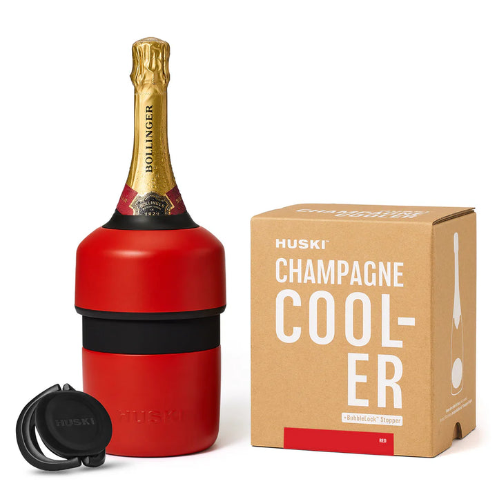 Red champagne cooler with gold bottle and Huski packaging on a white background
