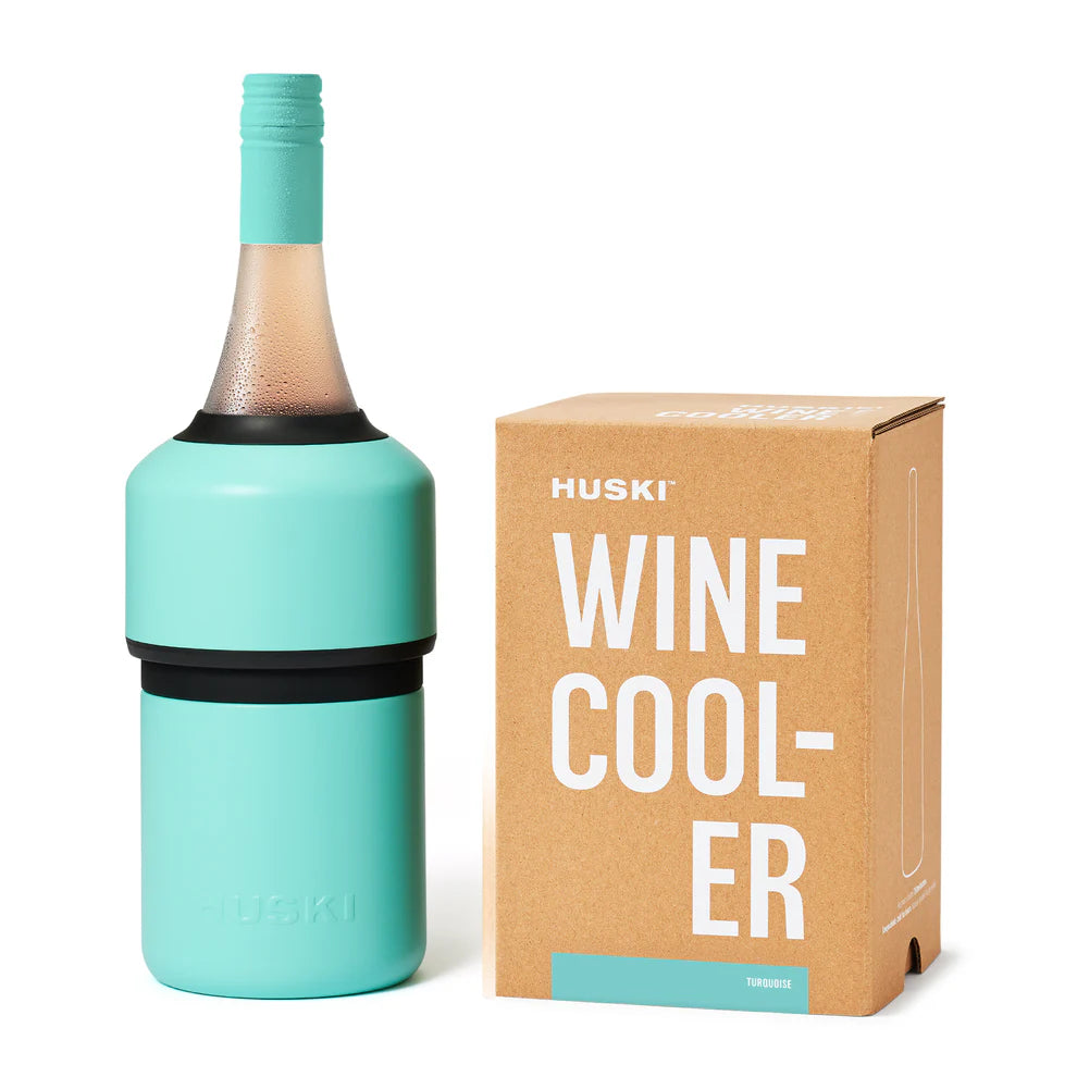 Turquoise Huski Wine Cooler with a bottle inserted next to its packaging on a white background